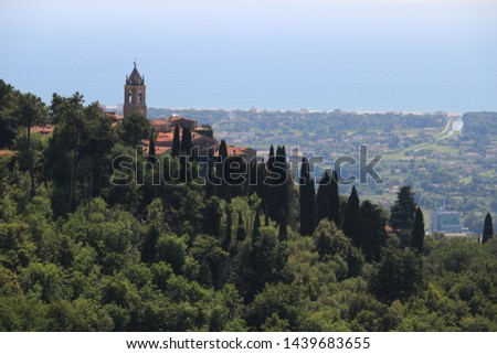 Ancient villages perched on the hills. In the background the sea and the Versilia coast. Royalty-Free Stock Photo #1439683655