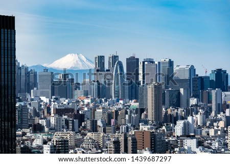 Mountain Fuji with Tokyo skylines and skyscrapers buildings in Shinjuku ward in Tokyo.