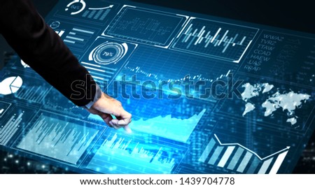 Big Data Technology for Business Finance Analytic Concept. Modern graphic interface shows massive information of business sale report, profit chart and stock market trends analysis on screen monitor. Royalty-Free Stock Photo #1439704778