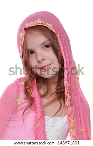 Fashion portrait of cute little girl with bright scarf over her head, isolated on white background