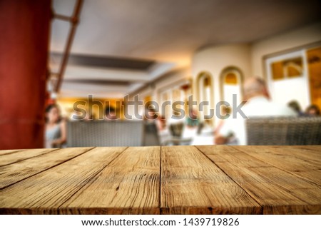 Desk of free space for your decoration and summer blurred background of garden. 