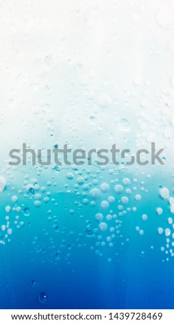 Iced Italian Soda in takeaway cup isolated on white background, macro.