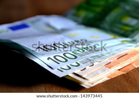 Bills lying on a table Royalty-Free Stock Photo #143973445