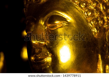 Close Up the face of Buddha Statue , Can see the details of the surface.