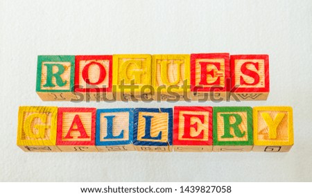 The term rogues gallery visually displayed on a clear background using colorful wooden toy blocks image in landscape format