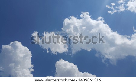 beautiful background of clouds, clearly visible lines of white clouds and blue sky, the top is a sunbeam
