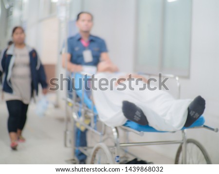 Medical team moving patient at the hospital blurred.