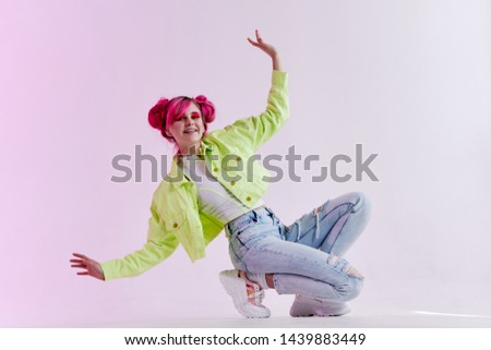 woman with pink hair in neon fashion style jeans