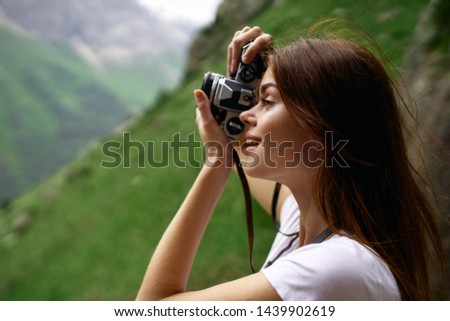 woman with camera snapshots of nature