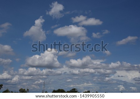 The atmosphere, the sky and the white clouds intersect with the fields and green trees. Giving the feeling of freshness, airy, bright, comfortable, comfortable eyes