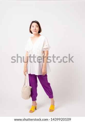 Asian woman casual fashion white background posing