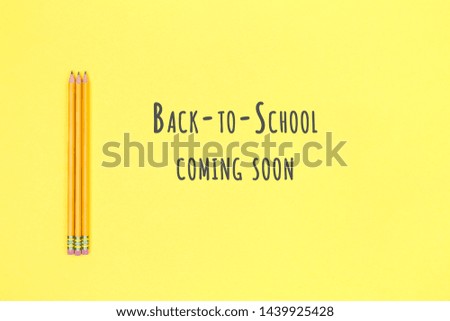 Pencils on a yellow background. Back to school concept. Horizontal. Back to school wording