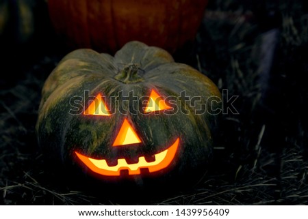 halloween pumpkin decor, jack lantern with burning eyes and canine mouth