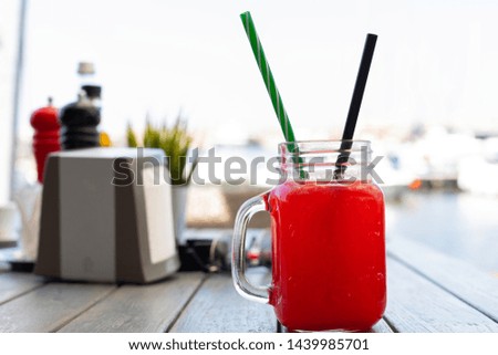 Picture of a refreshing strawberry lemonade at a bar near the beach