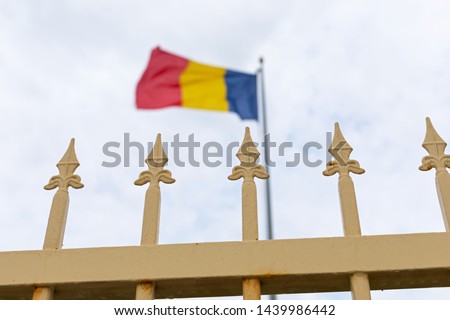 Picture of iron fence and the romanian flag at the bulgarian border, near Vama Veche