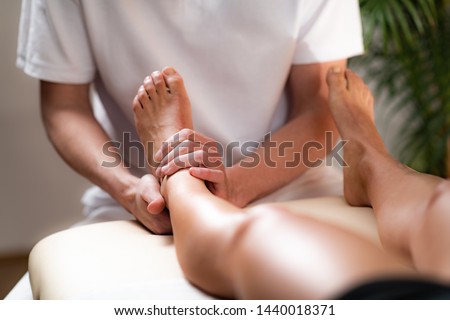 Osteopathy Treatment on Patient’s Leg

 Royalty-Free Stock Photo #1440018371