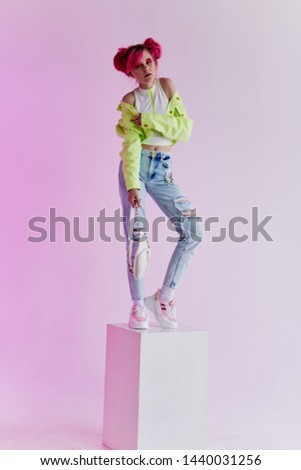 woman with pink hair stands on neon cube studio fashion retro