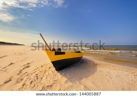 Small fishing boats close-up at sandy beach
