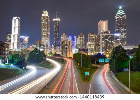 Skyline of Downtown Atlanta and Blurred Highway Traffic at Night - Atlanta, Georgia, USA