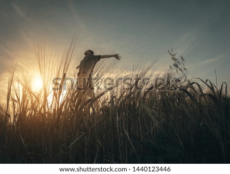 Silhouette of a young male at sunset jumping

