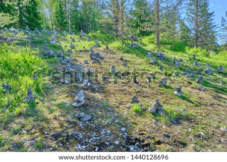Scenic view of several pyramids of stone near marble mine in Ruskeala national park in Karelia. Beautiful summer sunny look of rocks in popular touristic canyon on the North of Russian Federation