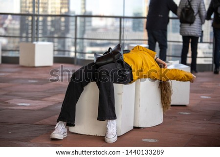SLEEPING GIRL IN THE MAS BUILDING IN ANTWERP Royalty-Free Stock Photo #1440133289
