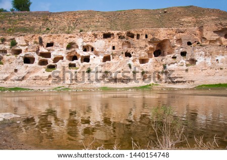 Hasankeyf is an ancient city famous for its caves carved from rocks. Royalty-Free Stock Photo #1440154748