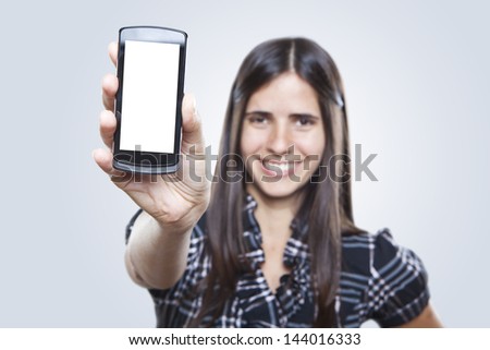 Happy young woman showing mobile phone