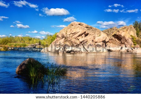 Amazing nature daytime landscape, scenic rocky canyon with river, rocks and blue sky with clouds, National park Bugski Guard, Mykolaiv region, Ukraine. Outdoor travel background