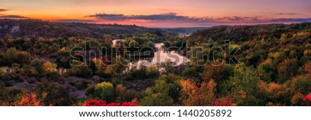 Amazing nature landscape, colors of autumn sunset over the scenic rocky canyon of Southern Bug river, large panorama. National park Bugski Guard, Mykolaiv region, Ukraine, outdoor travel background