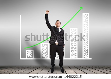 Businessman happy as graphs