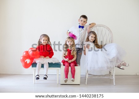 Kids boy and girls with red balloons