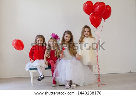 Kids boy and girls with red balloons
