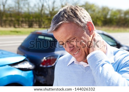 Driver Suffering From Whiplash After Traffic Collision Royalty-Free Stock Photo #144026332