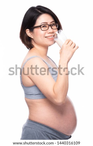Pregnant woman holding glass of milk in her hand good healthy, isolated on white background.