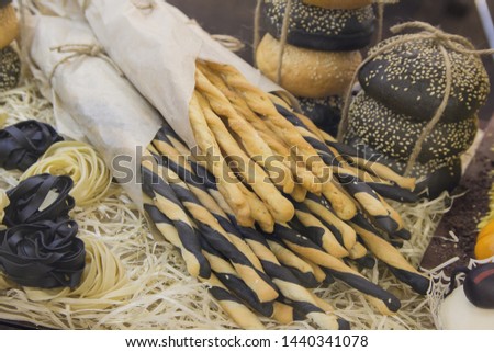 Fresh bread and various buns on the display. Bakery