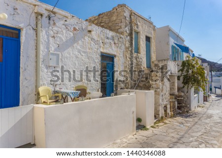 Street view of Chorio with paved alleys and traditional cycladic architecture in Kimolos island in Cyclades, Greece