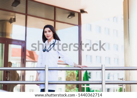 Female asian medical student. People - a doctor, a nurse and a surgeon on the background of the university's educational clinic. Health insurance. Medical Education.