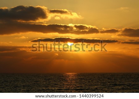 The sun sets over the horizon on the shores of the Mediterranean Sea in the north of the State of Israel.