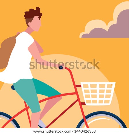 young man riding bike with sky orange