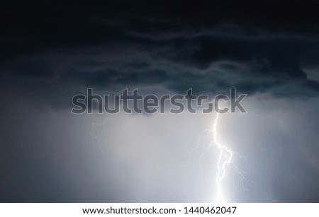 lightnings and thunder bolt strike at summer storm
