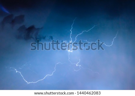 lightnings and thunder bolt strike at summer storm