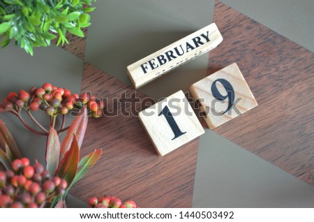Date of February month. Diamond wood table for background.