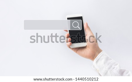 Searching and big data concepts with male hand using smart phone with search engine icon sign.Business information.global network system.minimal photo
