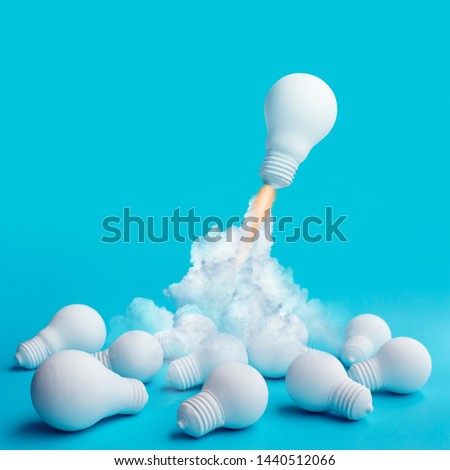 Ideas inspiration concepts with rocket lightbulb flying on group of another lightbulb.Business start up or goal to success. creativity of human Royalty-Free Stock Photo #1440512066