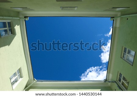 Square yard view from below with blue sky and clouds, Tallinn, Estonia