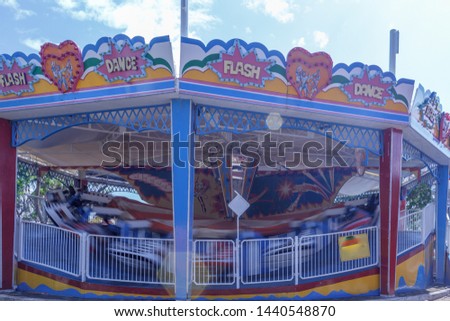 blur motion photography of flash dance ride during bright sunny day