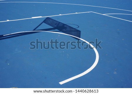 Abstract and texture of basket ball field during mid day.