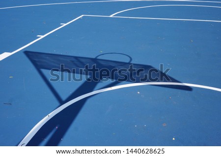 Abstract and texture of basket ball field during mid day.