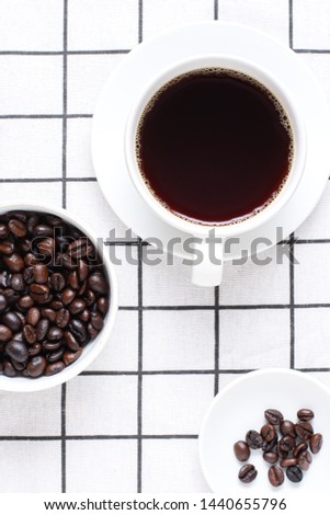 Coffee on the table, white coffee on the table and with coffee beans as a component, concepts for relaxation drinks and breakfast